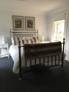 Ένα ή περισσότερα κρεβάτια σε δωμάτιο στο Drayshed cottage