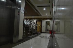 a hallway of a building with a staircase in it at Manazilna Apartments Riyadh منازلنا للشقق المفروشة in Riyadh