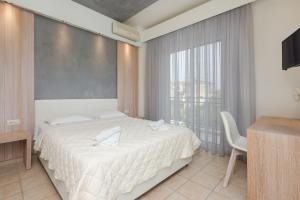 Postel nebo postele na pokoji v ubytování Hotel George