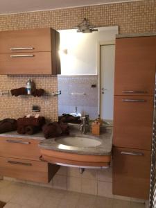 A kitchen or kitchenette at La Porta Nel Giardino