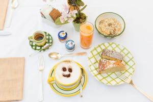 a table with a plate of food and a cup of coffee at Relais Regina Giovanna in Sorrento
