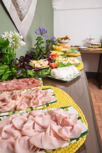 a table topped with lots of different types of food at Relais Regina Giovanna in Sorrento