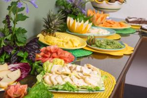 a table with many plates of food on it at Relais Regina Giovanna in Sorrento