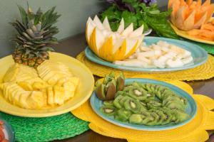 a table topped with plates of food with fruits and vegetables at Relais Regina Giovanna in Sorrento
