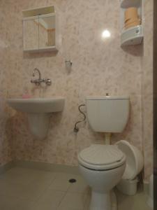 a bathroom with a toilet and a sink at Apartments Anita in Nesebar +27 photos
