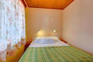 Postel nebo postele na pokoji v ubytování Apartments Josip & Maria