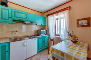 Kuchyň nebo kuchyňský kout v ubytování Apartments Josip & Maria