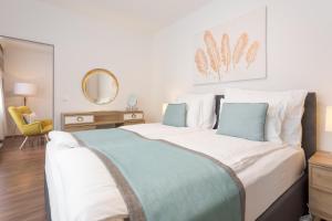 En eller flere senge i et værelse på Mar Suite Apartments - Simmering