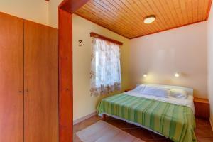 Postel nebo postele na pokoji v ubytování Apartments Josip & Maria