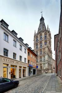 a street in a city with a building at Stern am Rathaus in Cologne