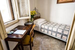 Postel nebo postele na pokoji v ubytování Hotel Il Bargellino