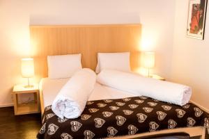 Postel nebo postele na pokoji v ubytování Hotel Alpina