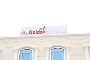 a sign on the top of a building at Golden Season Furnished Apartments 5 in Salalah
