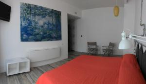 Postel nebo postele na pokoji v ubytování BB SharingLoft Sirmione