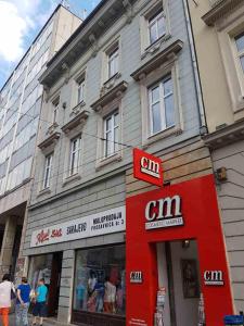 a building with a cinn sign in front of a store at Sarajevo city rent in Sarajevo
