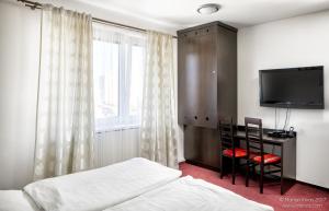 Posteľ alebo postele v izbe v ubytovaní Garni HOTEL Fellini