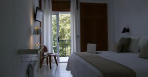 Кровать или кровати в номере Hotel Farsund