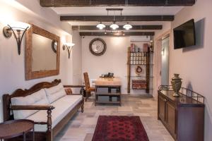 a living room with a couch and a table at Konaki Ouranoupolis in Ouranoupoli