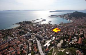 an aerial view of a city with a yellow arrow at House Sandra in Split