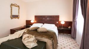 Postel nebo postele na pokoji v ubytování Hôtel & Restaurant Le Relais d'Aumale