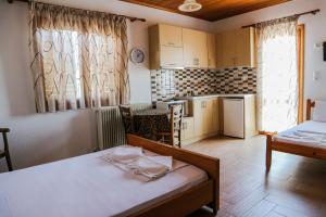 Postel nebo postele na pokoji v ubytování Hotel Elatofilito