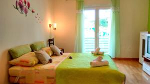 Posteľ alebo postele v izbe v ubytovaní Apartments Desa Petric
