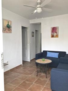 a living room with a couch and a table at Sol de Bolonia 8 in Bolonia
