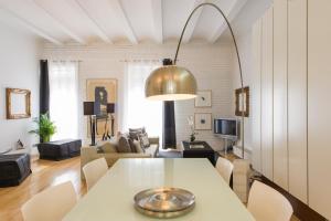 a living room with a table and a couch at Art Apartment Ruzafa in Valencia