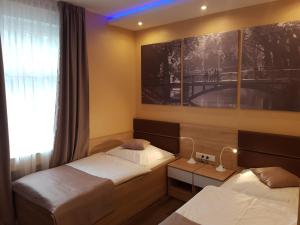 Katil atau katil-katil dalam bilik di Hotel Haus Büderich