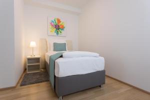 Łóżko lub łóżka w pokoju w obiekcie Mar Suite Apartments - Center