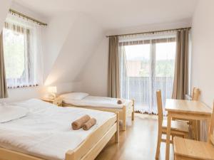 Postel nebo postele na pokoji v ubytování Pokoje Gościnne Bachledzki Wierch