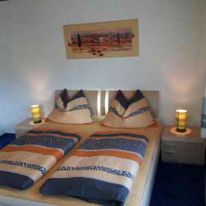 a bedroom with two beds with pillows on them at Ferienwohnung Franck in Kleinarl