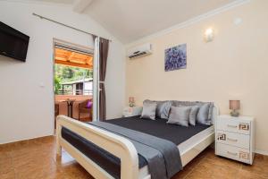 Postel nebo postele na pokoji v ubytování Apartment Krželj