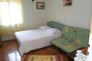 Postel nebo postele na pokoji v ubytování Apartments Belas