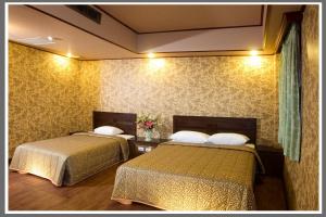 Postel nebo postele na pokoji v ubytování Hotel Lee-Chan