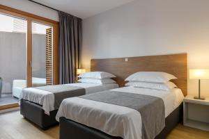 Postel nebo postele na pokoji v ubytování Luxury Apartment Kampanel