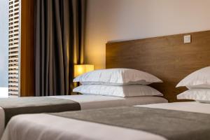 Postel nebo postele na pokoji v ubytování Luxury Apartment Kampanel