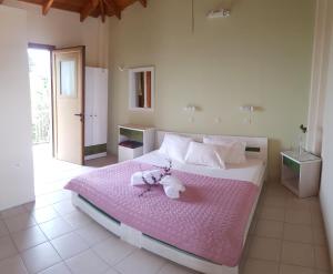 Postel nebo postele na pokoji v ubytování Epi Apartments
