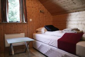 A bed or beds in a room at Guesthouse Svartiskógur Egilsstaðir