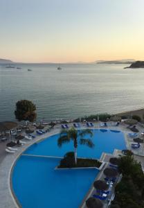 an aerial view of a resort with a large swimming pool at Hotel Golden Sun in Finikounta