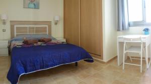 a bedroom with a bed with two teddy bears on it at Apartamento fuerte in Puerto del Rosario