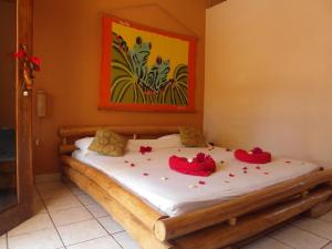 Postel nebo postele na pokoji v ubytování Samara Palm Lodge