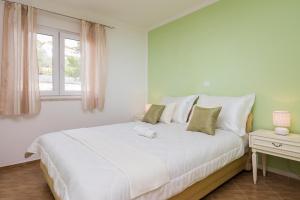 Postel nebo postele na pokoji v ubytování Apartment Krželj