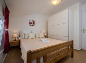 Postel nebo postele na pokoji v ubytování Apartment Krželj