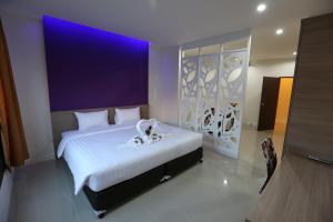 A bed or beds in a room at S4 Nai Yang Beach - SHA EXTRA PLUS