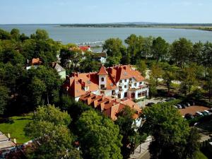 an aerial view of a large house with red roof at Dworek Morski SPA & Wellness in Mielno