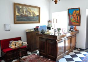 a room with a desk with books on it at Margarita Hotel in Kythira