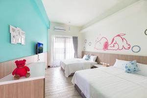 Postel nebo postele na pokoji v ubytování Sanwu Homestay