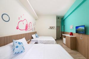 Postel nebo postele na pokoji v ubytování Sanwu Homestay