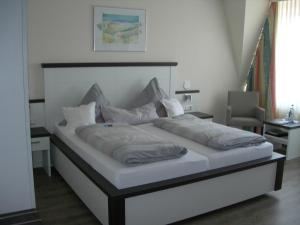 Postel nebo postele na pokoji v ubytování Apart Hotel Norden